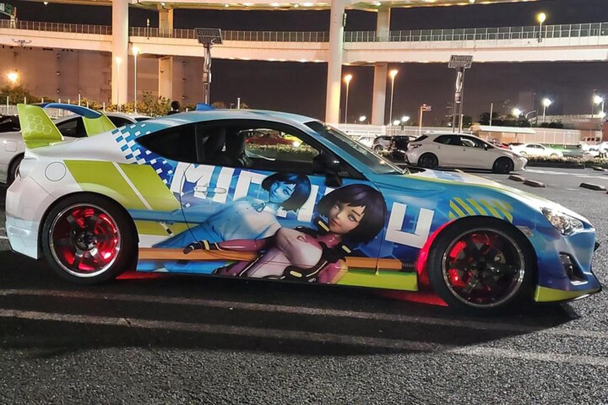 a car with anime painted on the side of it
