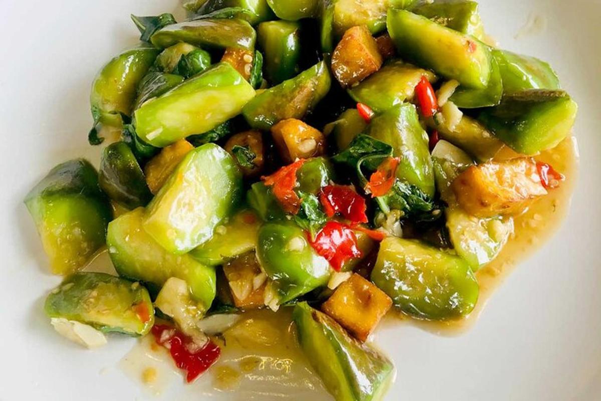a white plate of food with vegetables on it