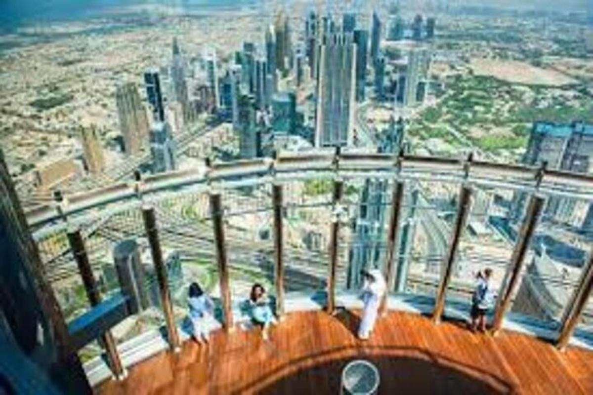 a group of people standing on the top of a building