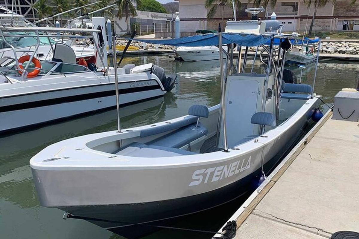 a small boat is docked at a dock