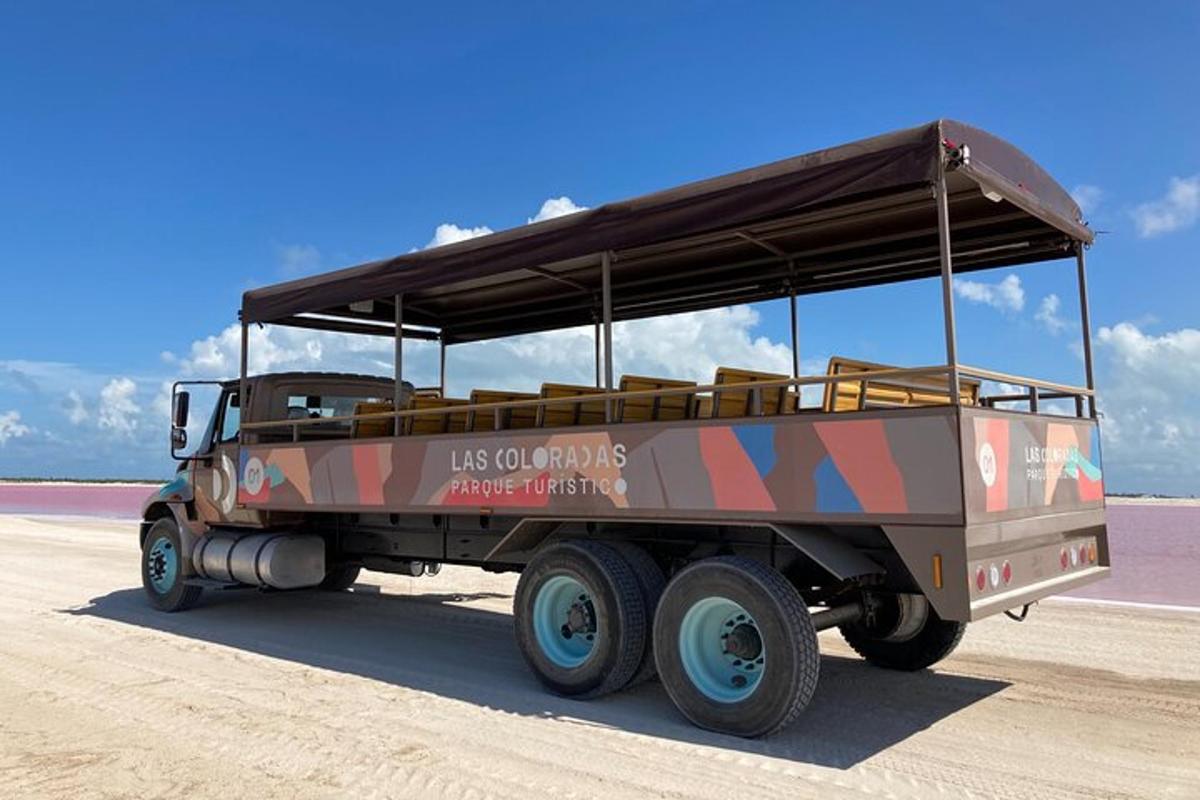 a military truck is parked on the beach