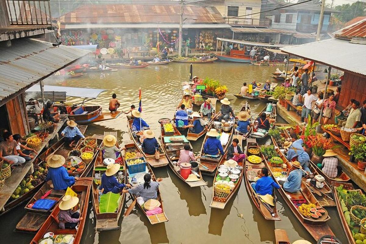 a group of people in boats in a market