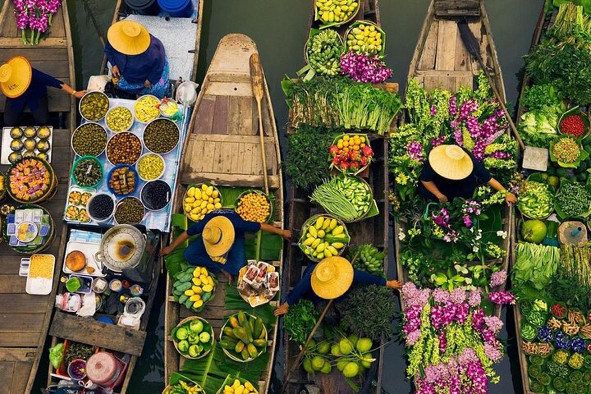 a group of people in boats filled with fruits and vegetables