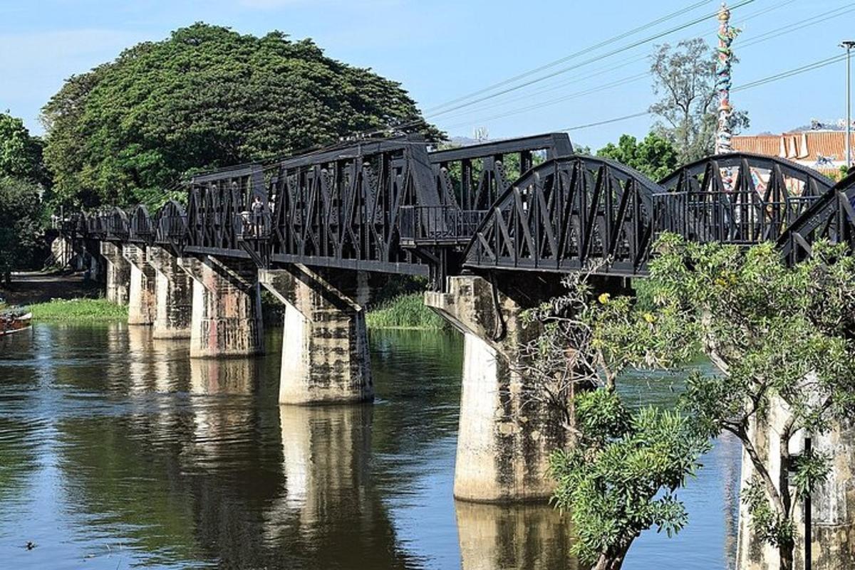 a bridge over a river with people walking on it