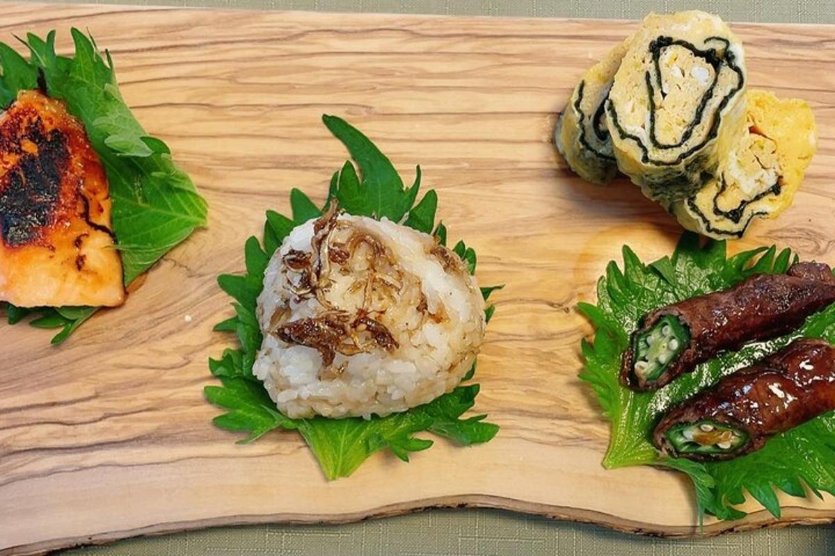 a wooden cutting board with sushi and vegetables on it