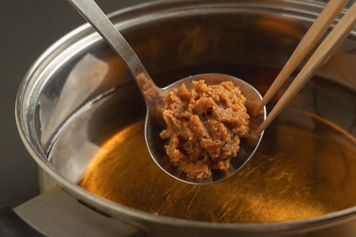 a spoon full of food in a pot