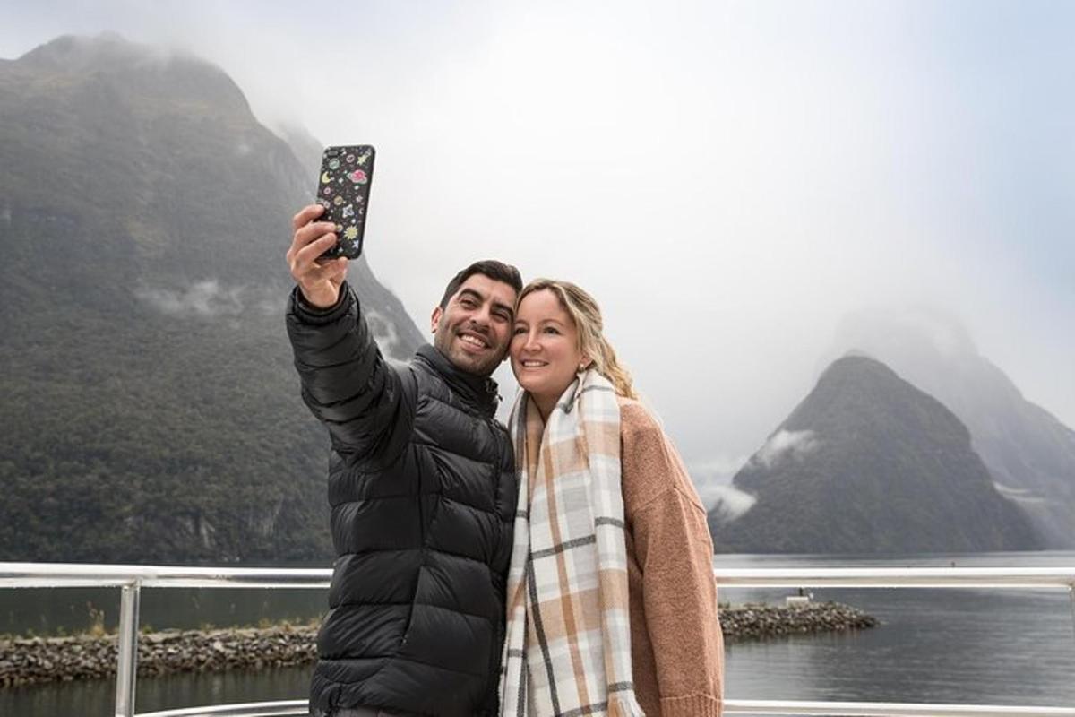 a man and woman taking a picture of a mountain