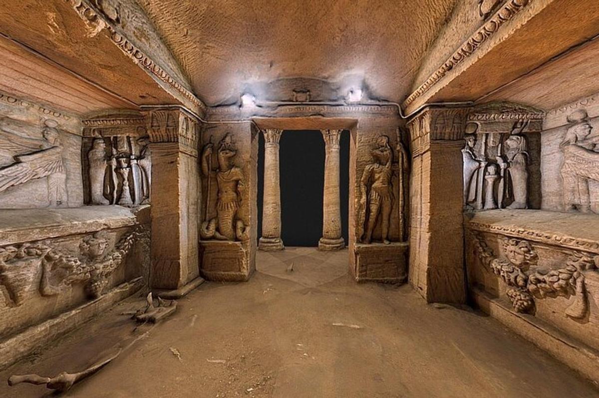 an ancient room with carvings on the walls