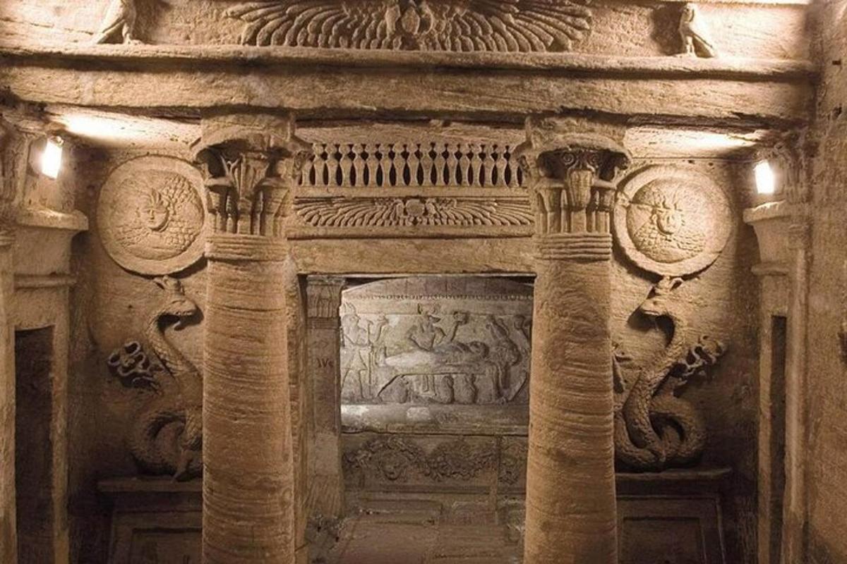 a stone archway with carvings on the wall