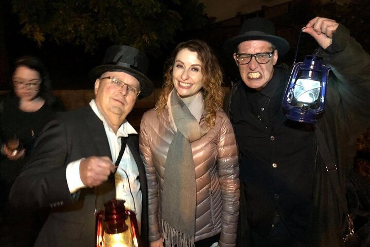 a group of three people posing for a picture