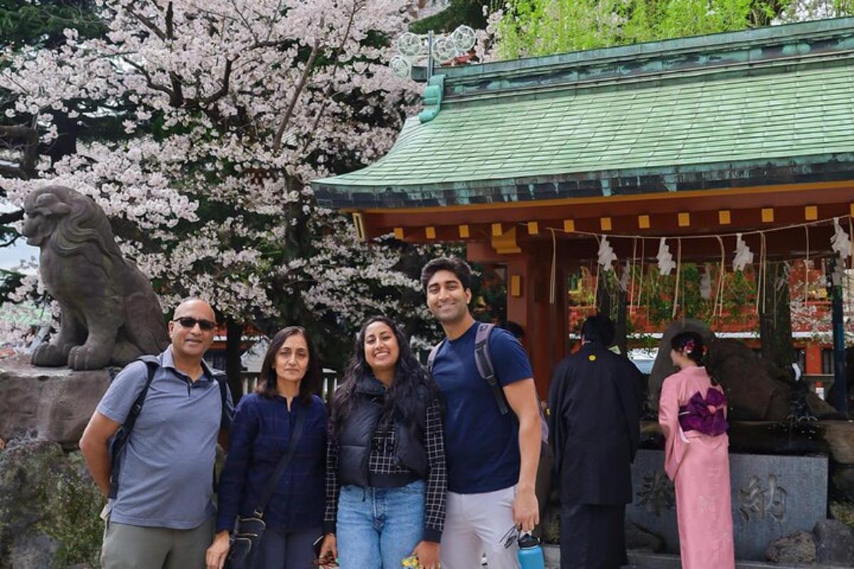 a group of people standing in front of a statue
