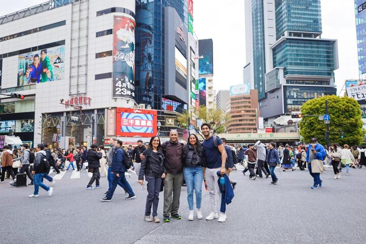 a group of people crossing a street in a city