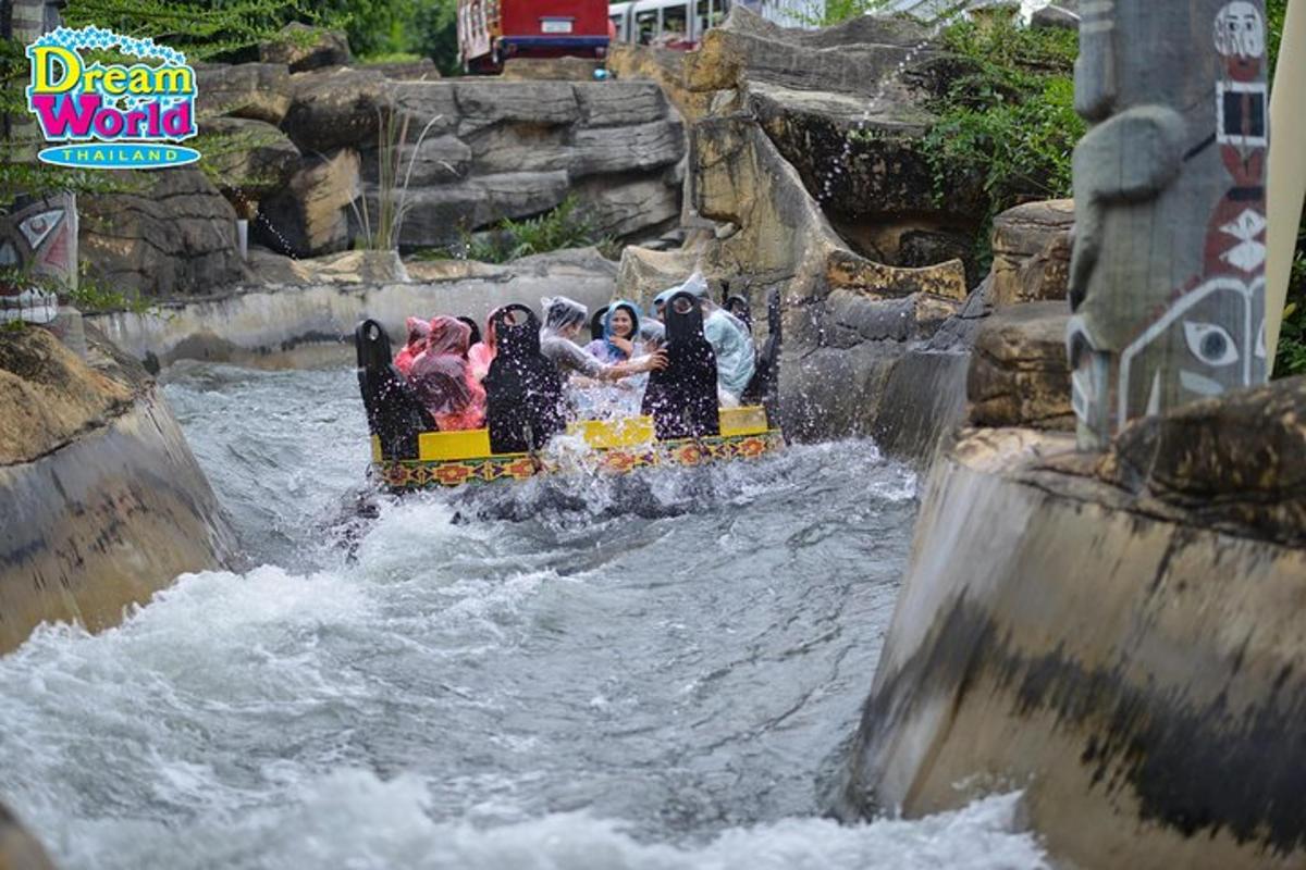 a group of people riding a raft in a rap river