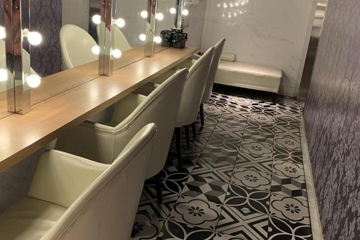 a row of chairs in a room with a long table