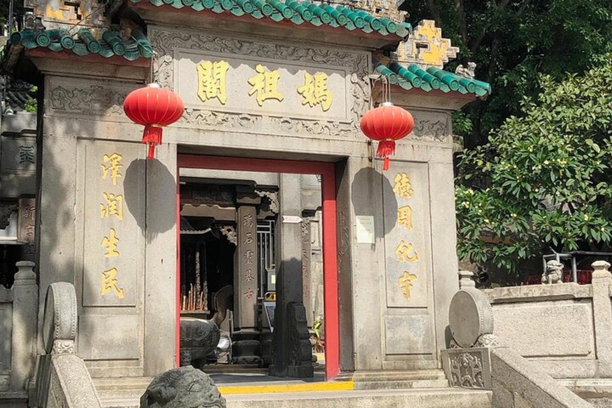 a temple with red lanterns in a building