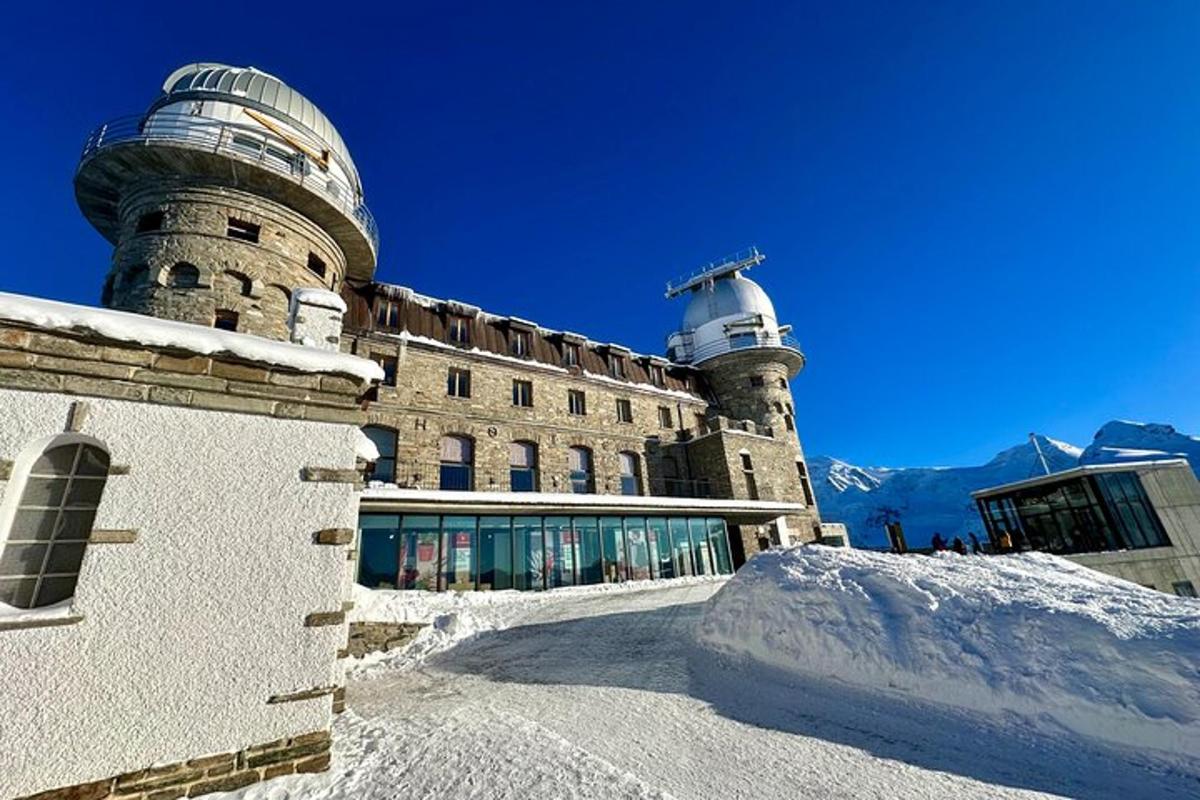 a building with a snow pile in front of it