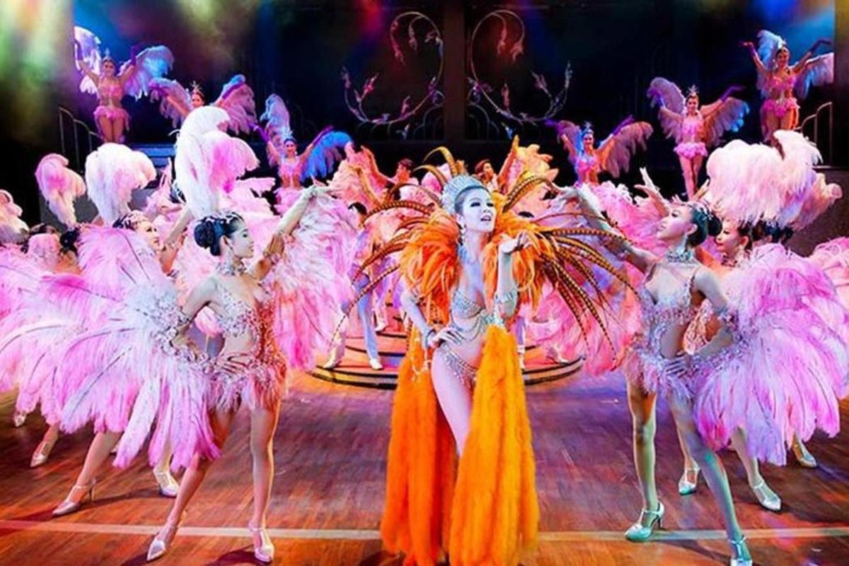a group of dancers in pink costumes on a stage