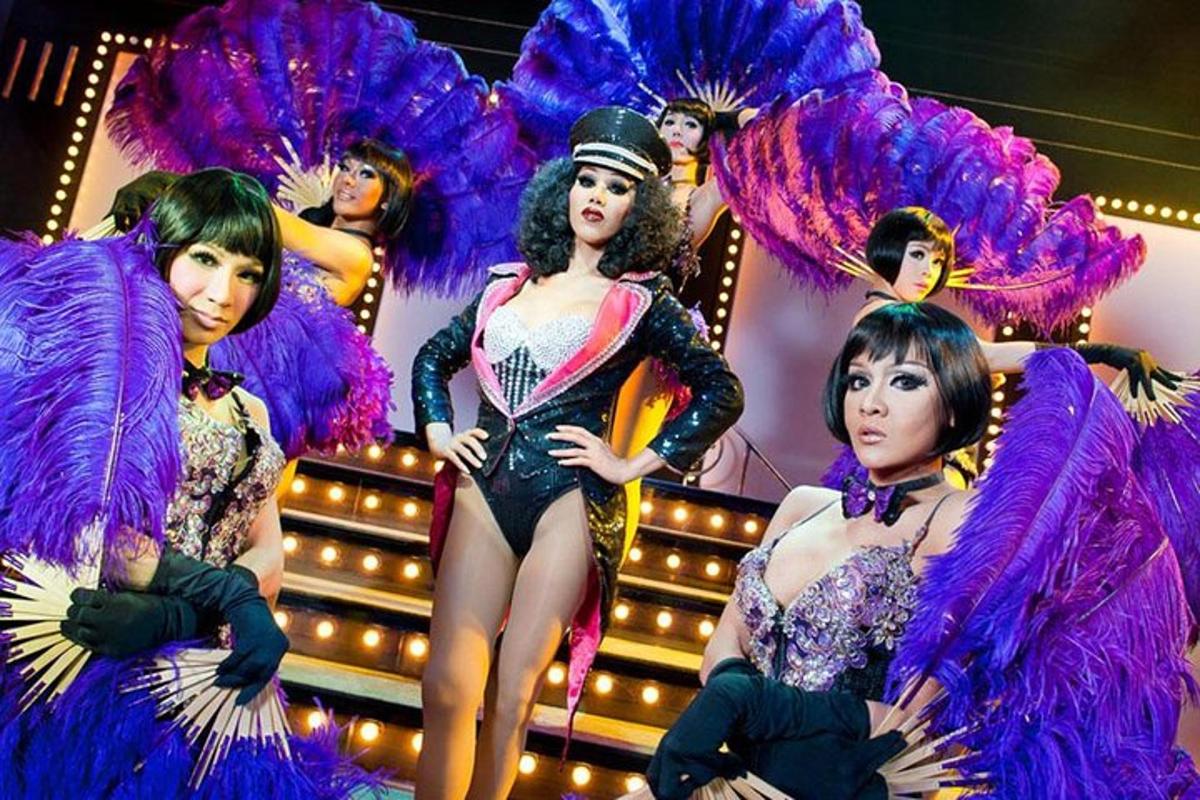 a group of women in costumes on a stage