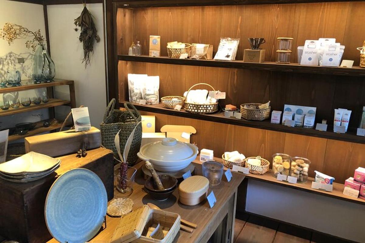 a room with a table with bowls and baskets on shelves