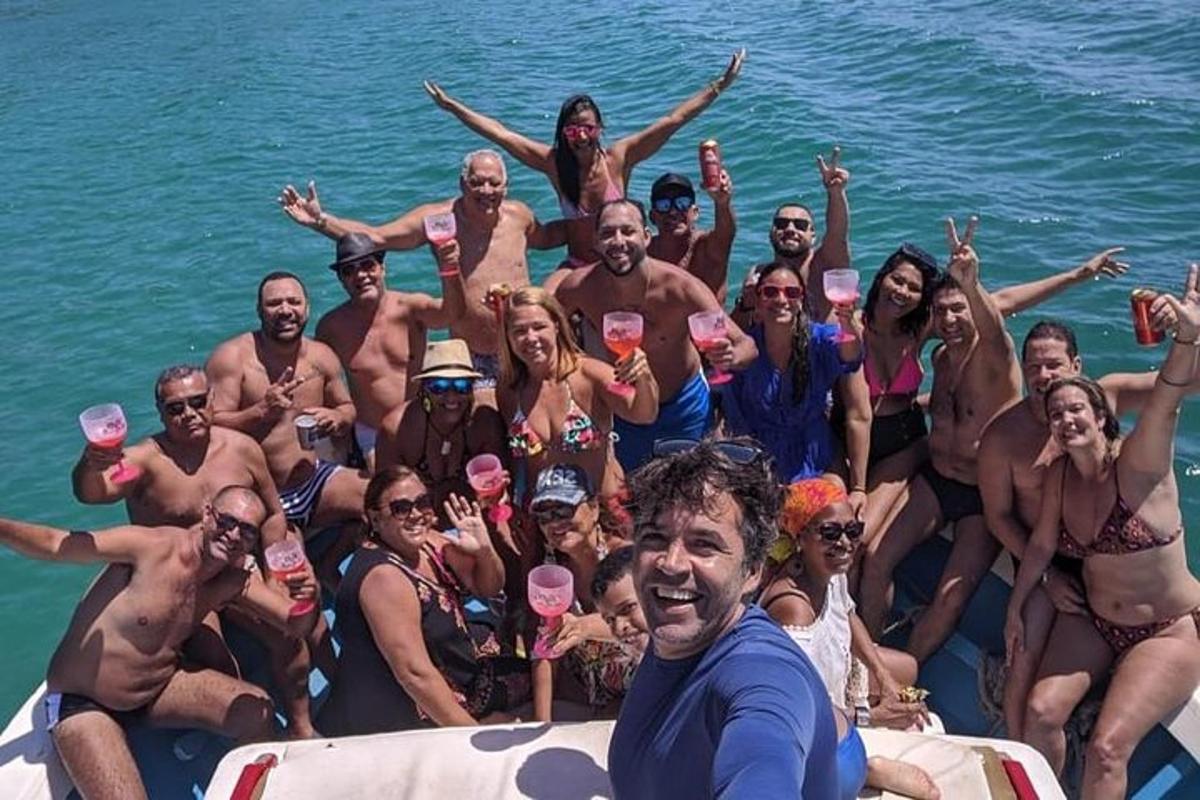 a group of people on a boat in the water