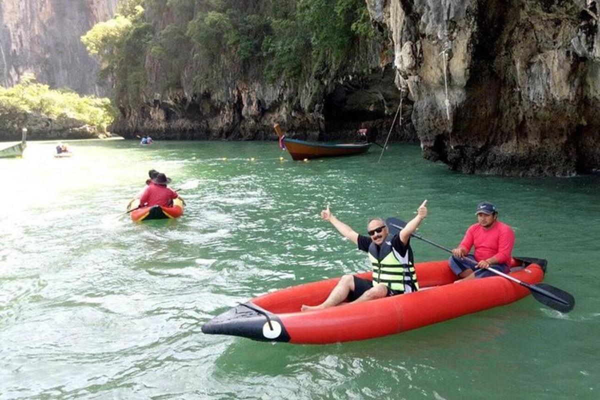 a group of people in a raft in the water