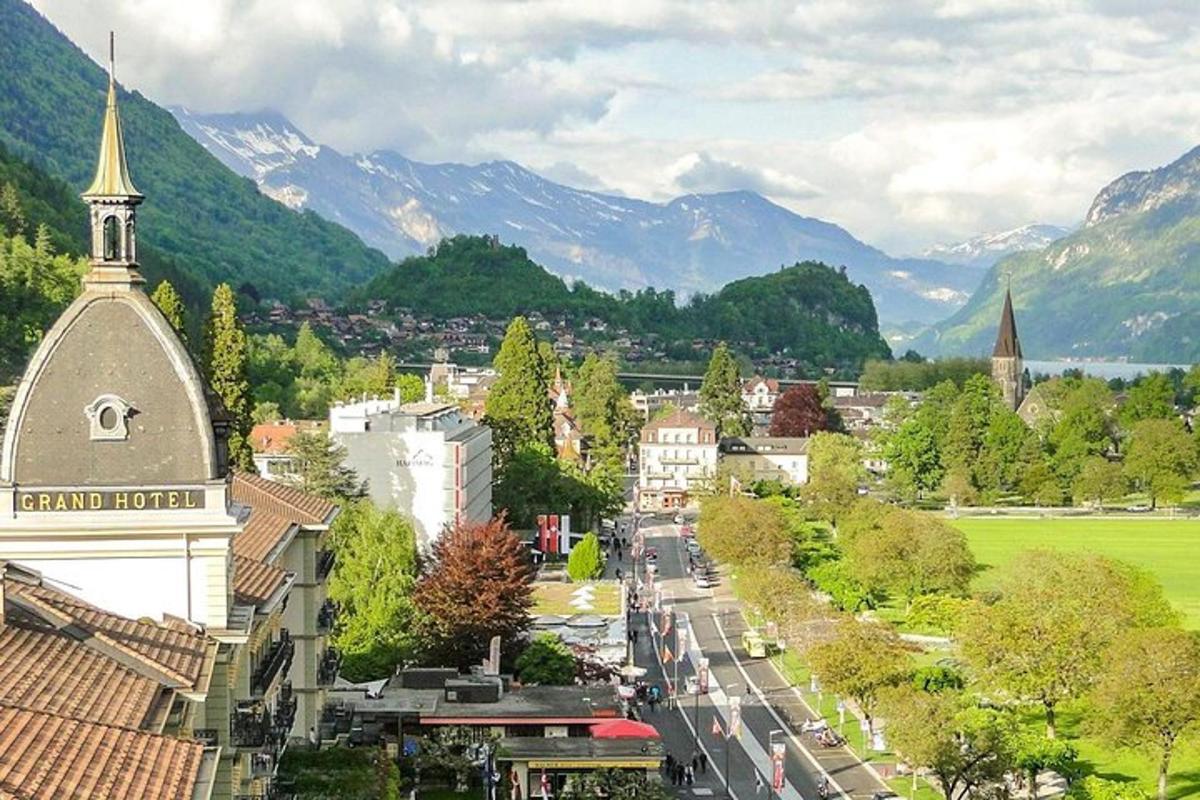 a view of a city with mountains in the background