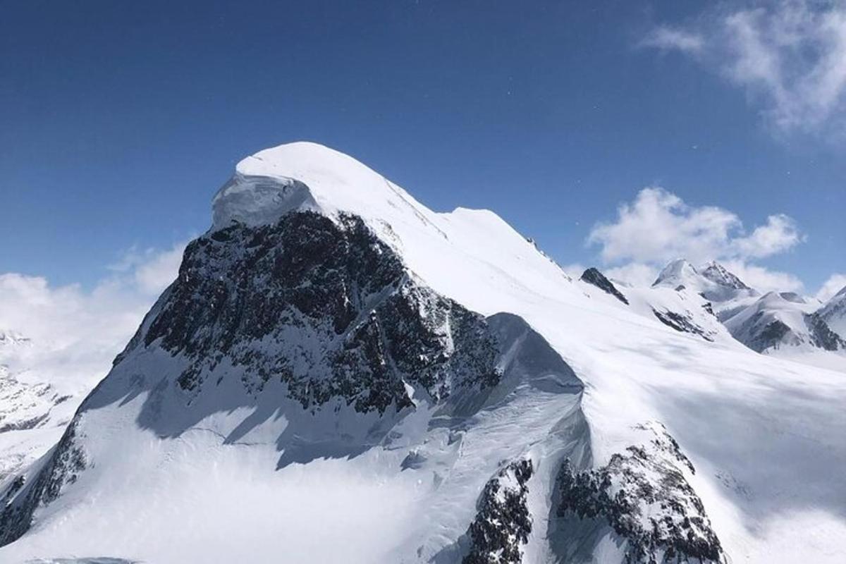 a mountain covered in snow on top