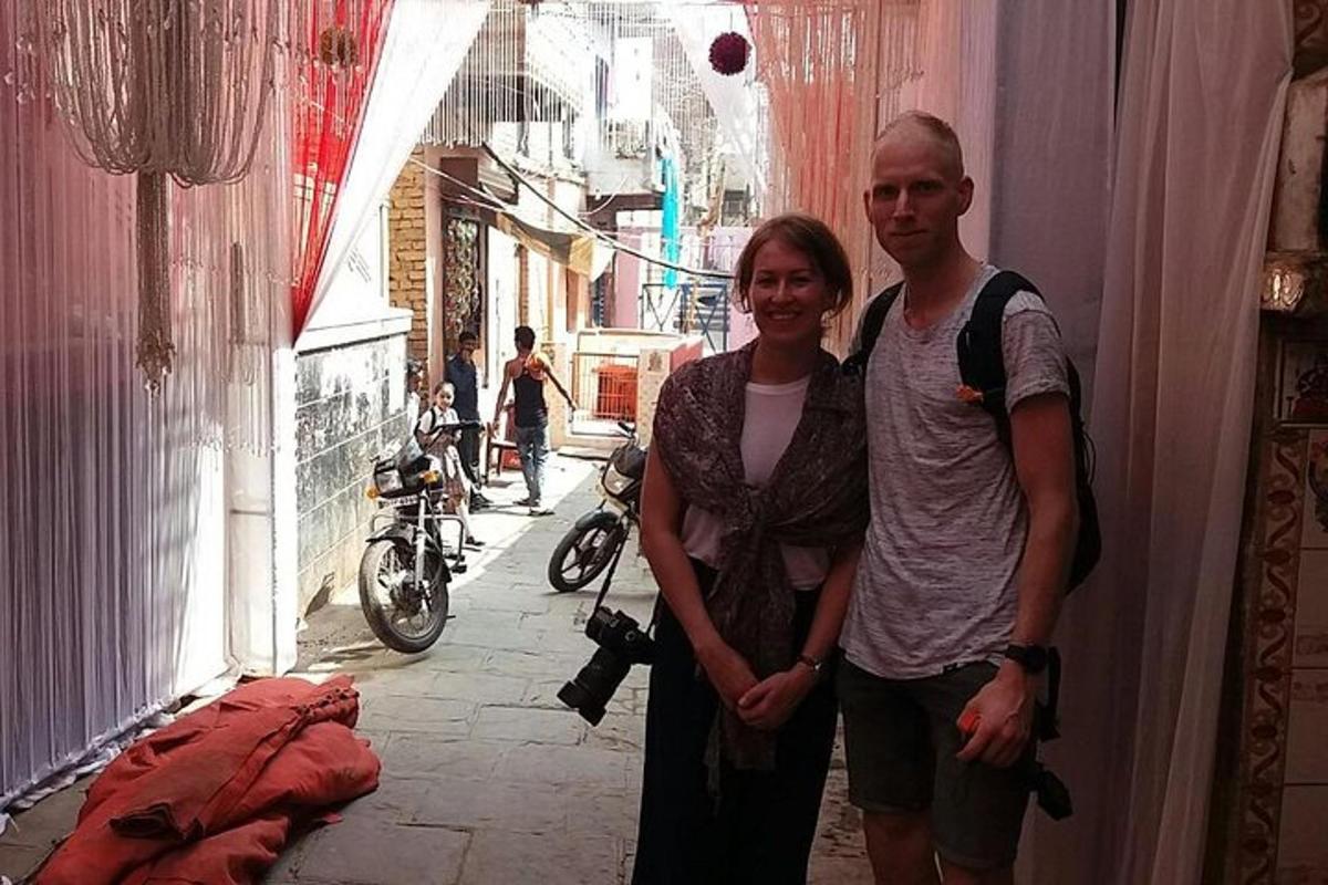 a man and a woman standing in a alley