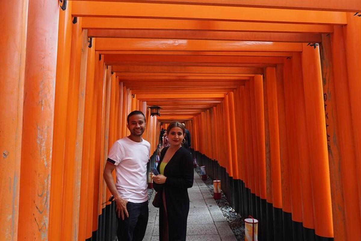 a man and a woman walking through an orange corridor