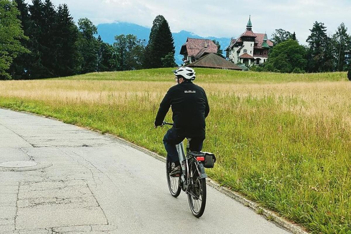 a man riding a bike down a road