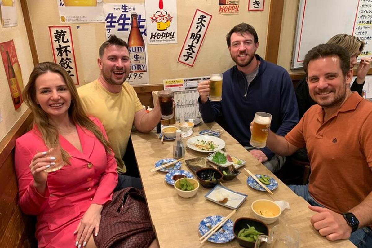 a group of people sitting at a table drinking beer