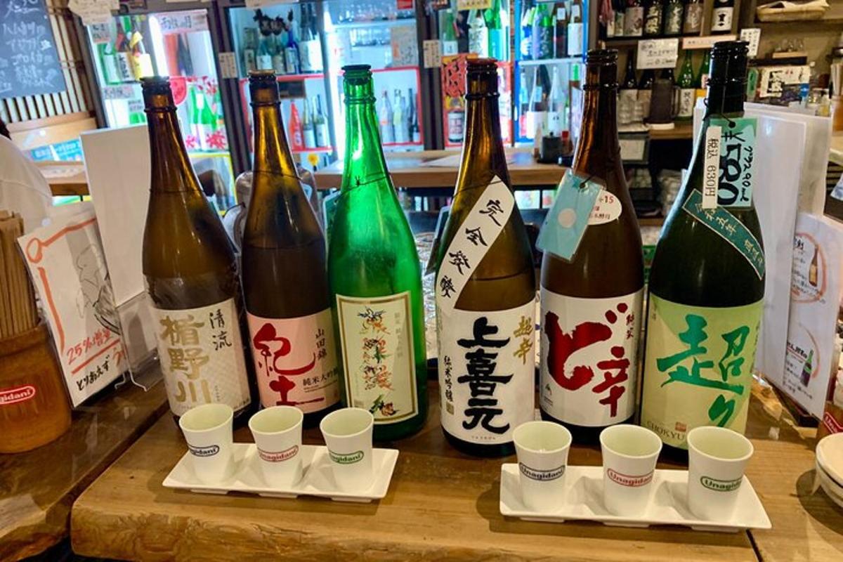 a group of bottles of wine sitting on a counter