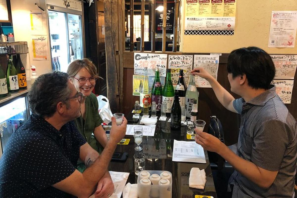 a group of people sitting at a bar