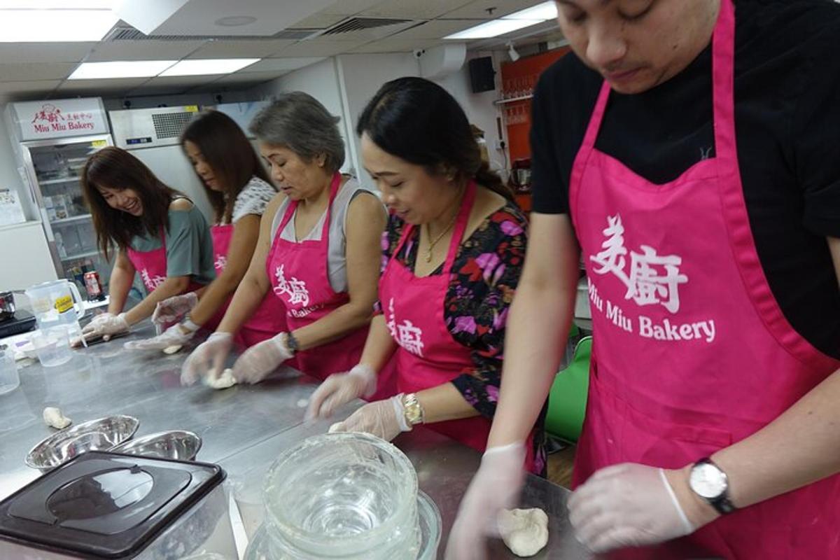 a group of women in a kitchen preparing food