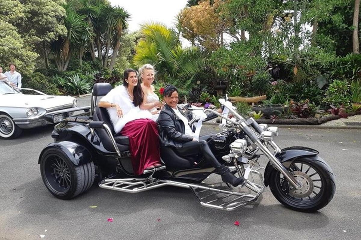 a group of women riding on the sidecar of a motorcycle