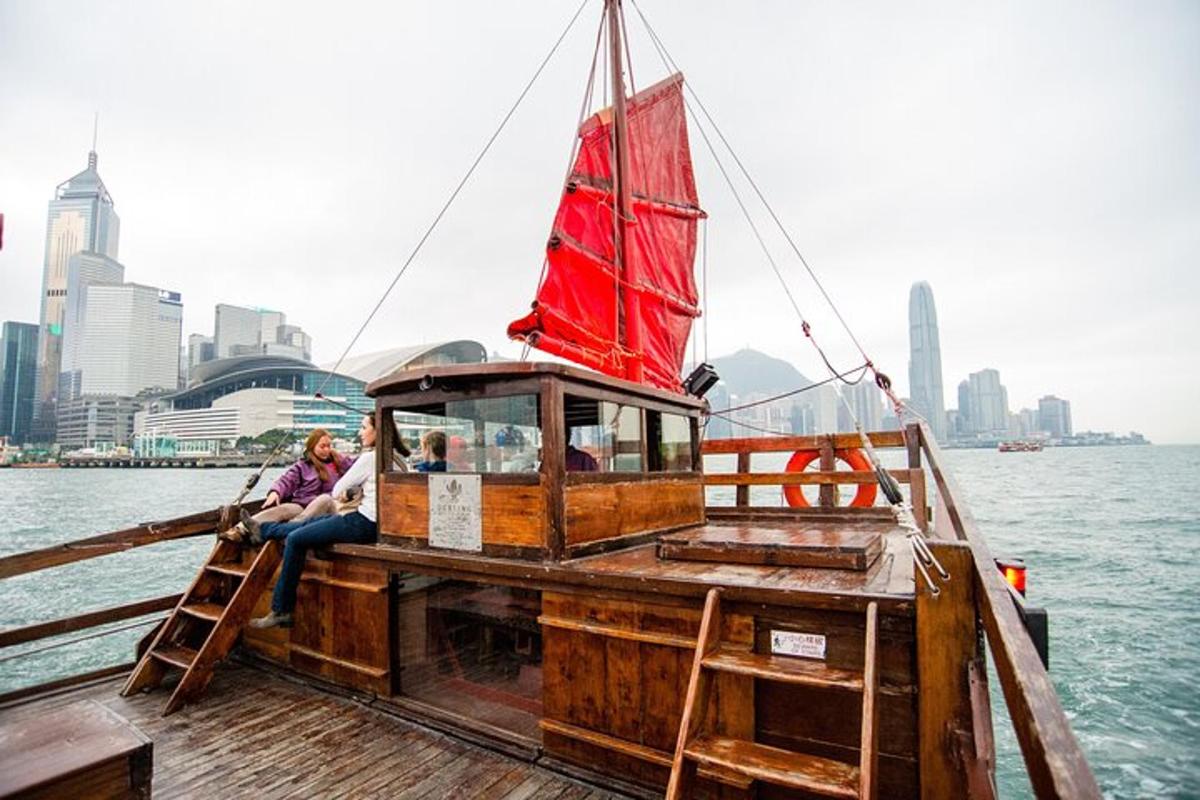 a group of people sitting on a boat on the water