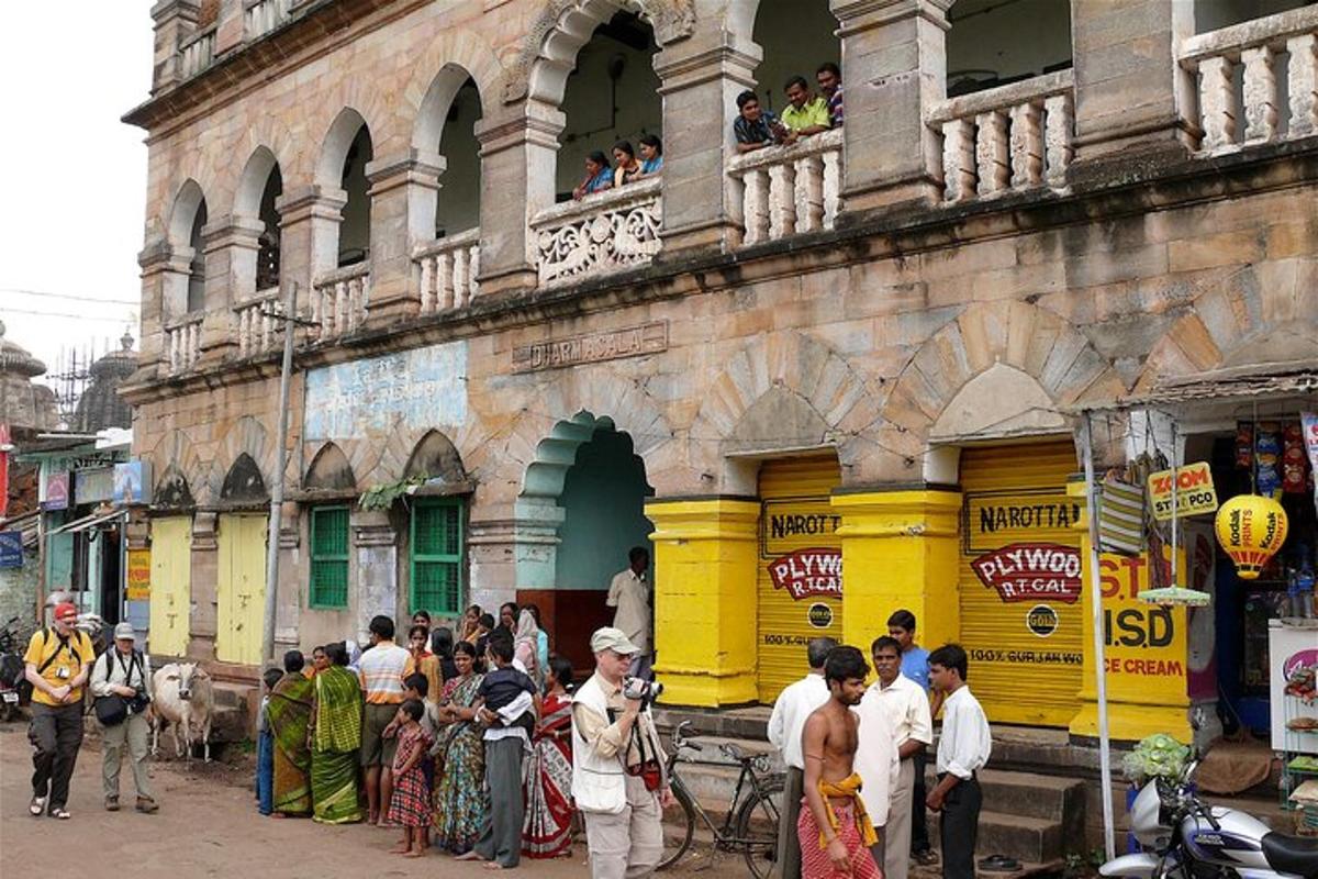 a group of people standing outside of a building