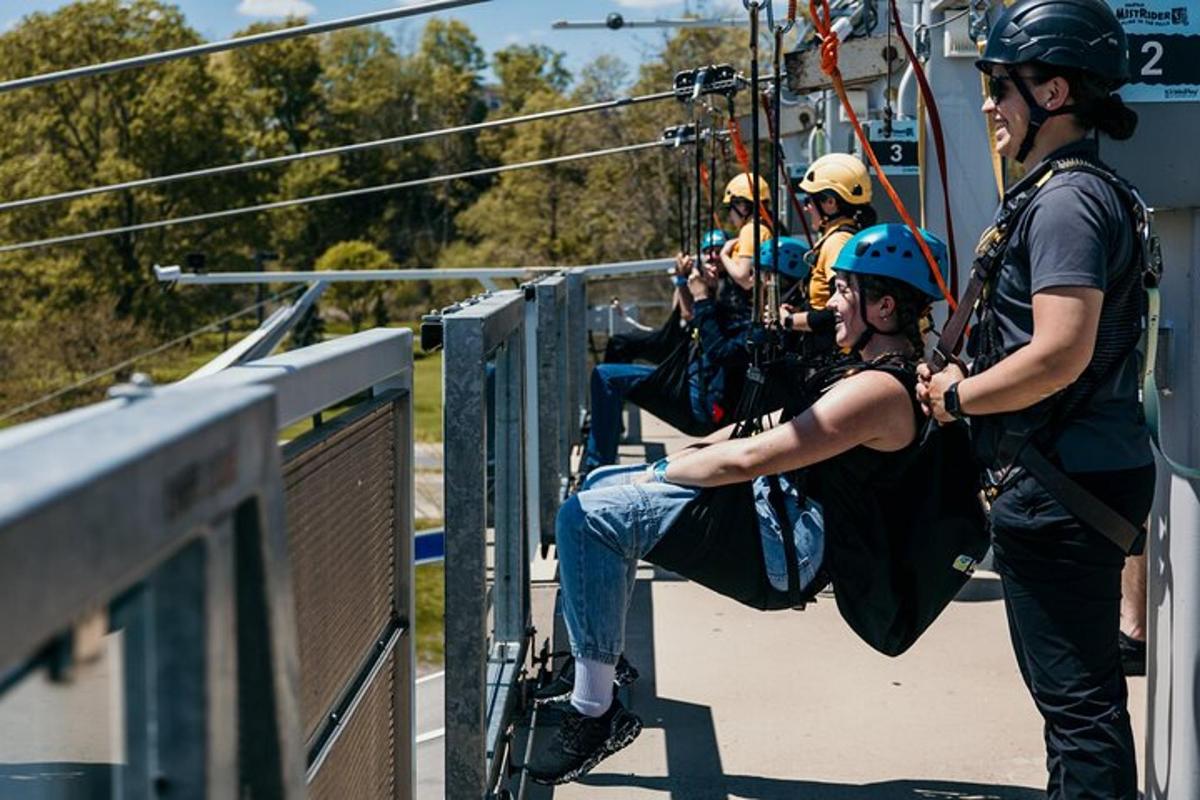 a group of people on a zip line