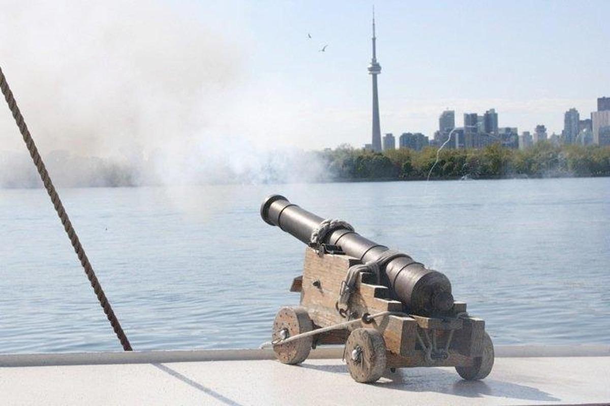 a cannon on the side of a body of water