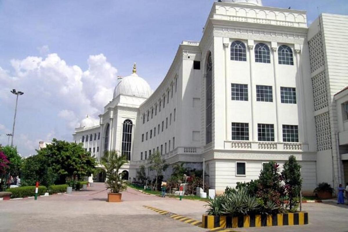 a large white building with a dome on top of it