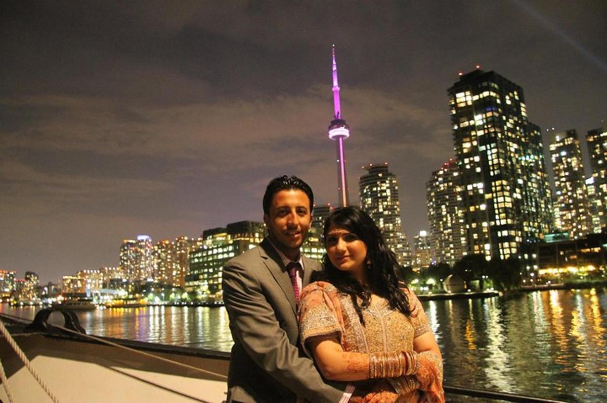 a man and a woman standing in front of a city