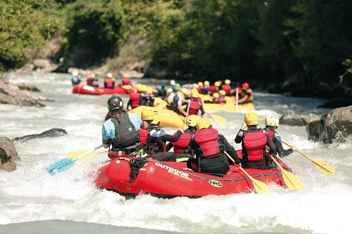 a group of people in a raft in a river