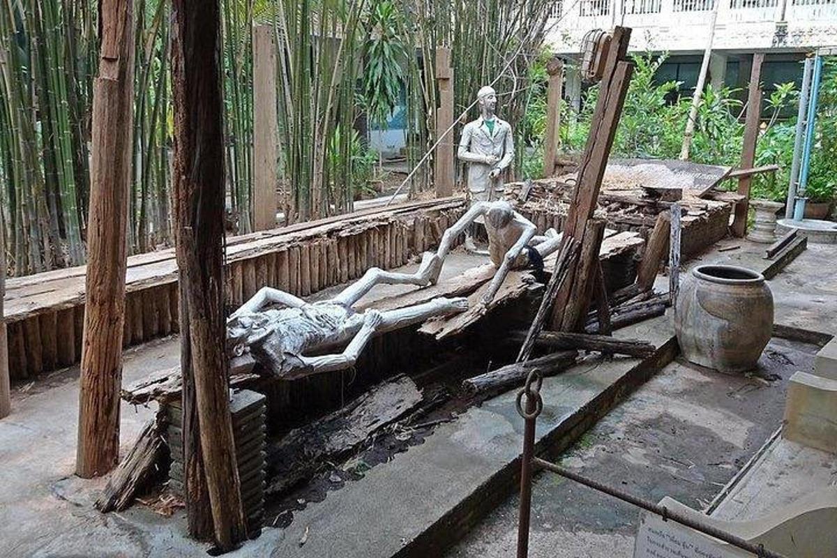 a statue of two people laying on a bed