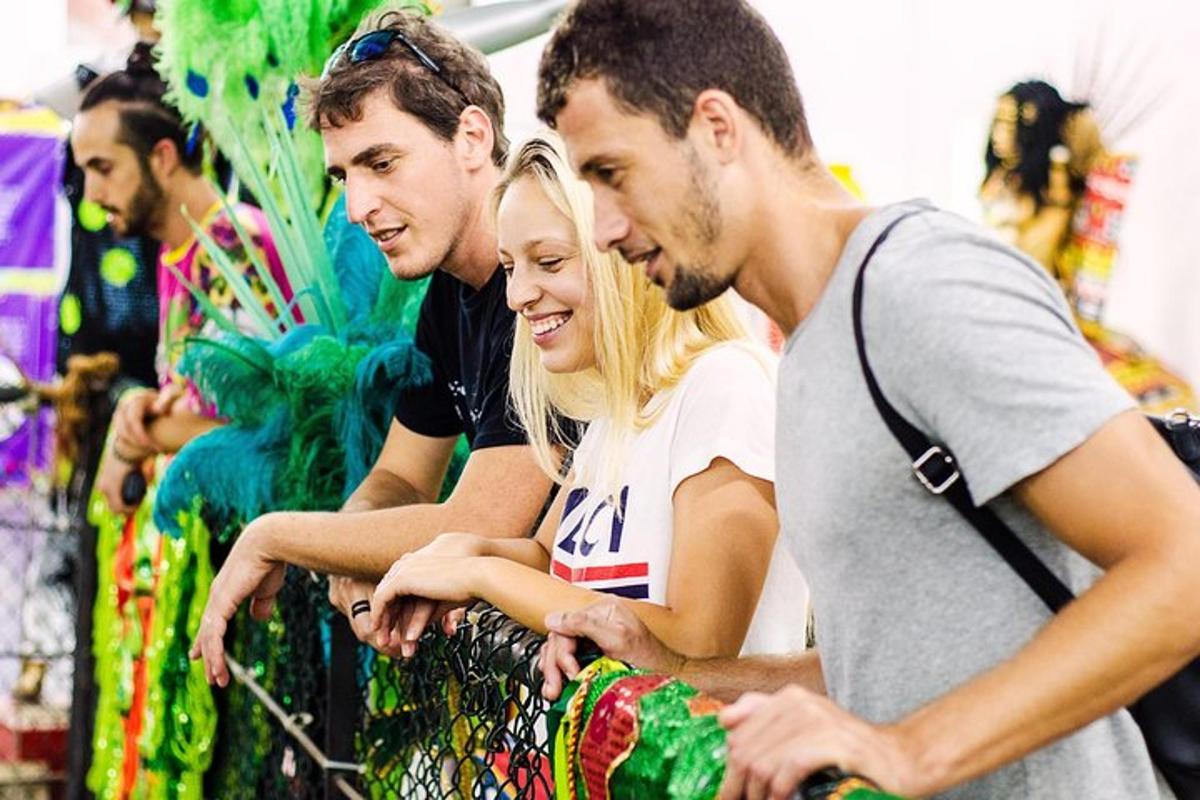 a group of three people looking at something
