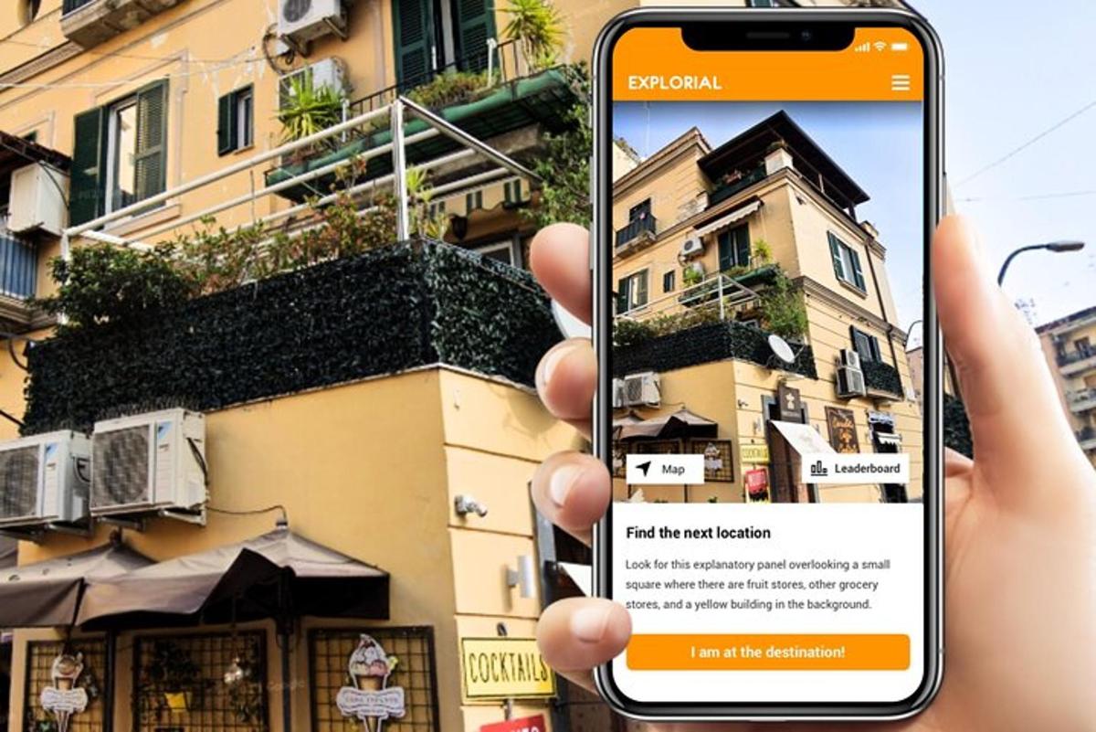 a person holding up a cell phone in front of a building