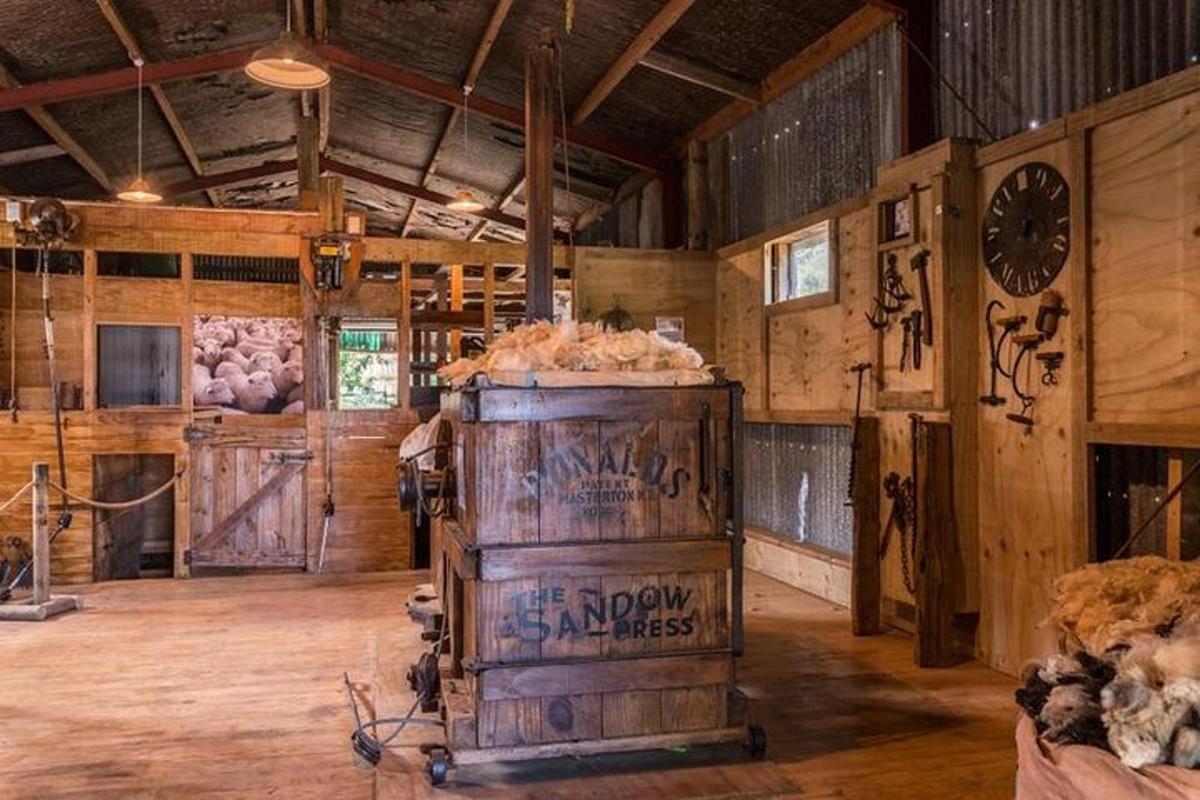 a large room with a wooden barn with a barrel