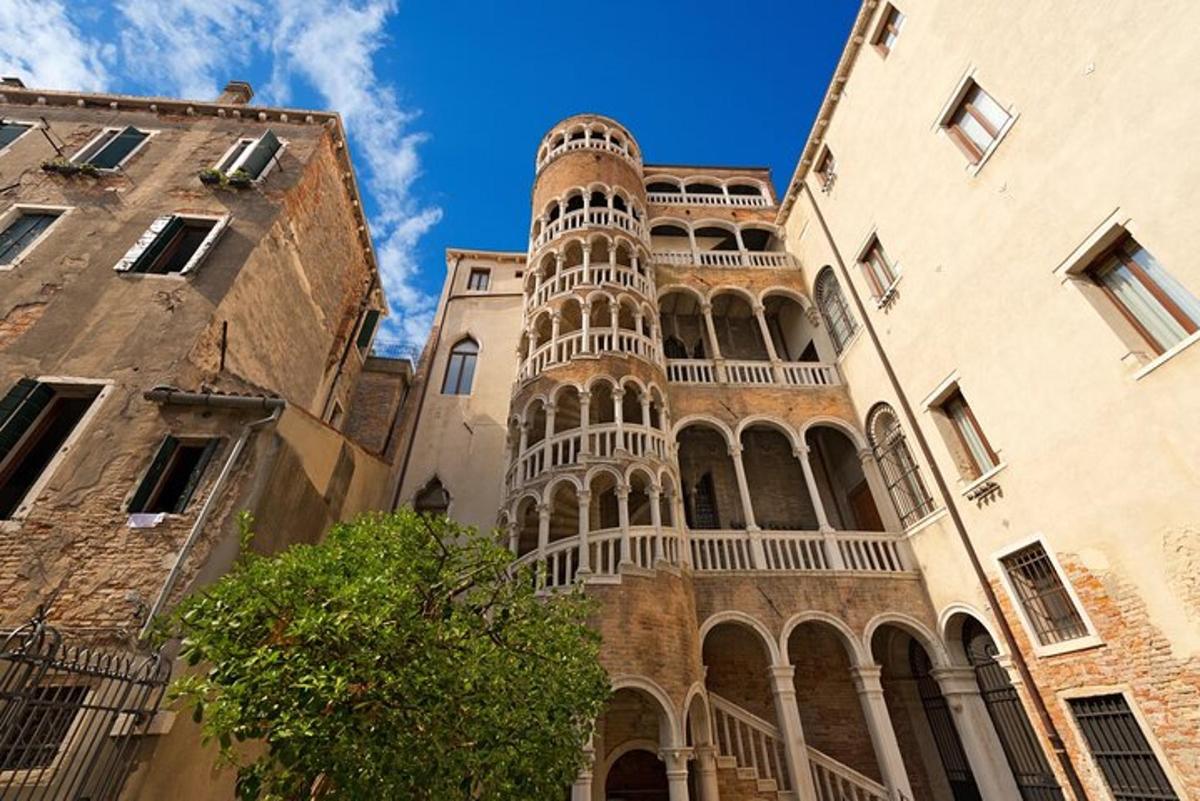 a tall building with a tower in between two buildings