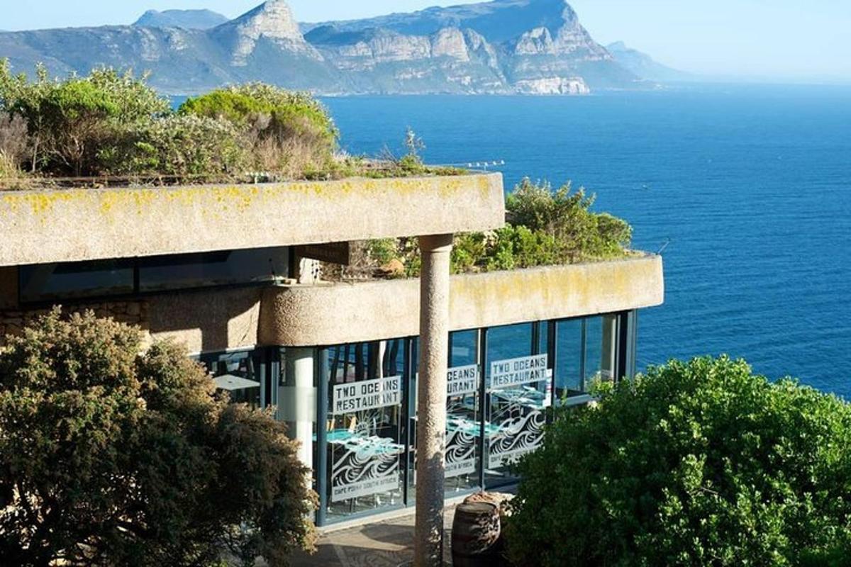 a building with a view of the ocean and mountains