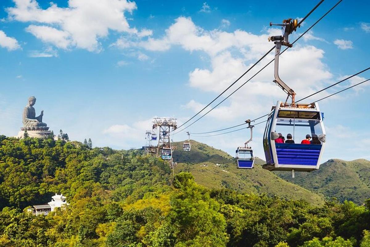 a group of people riding a gondola over a mountain