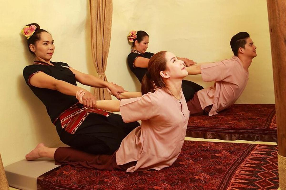 a group of people sitting on beds in a room
